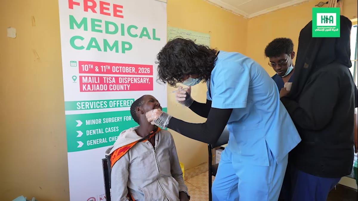 A volunteer dentist treating a patient at the free medical camp, Maili Tisa Dispensary, Kajiado County