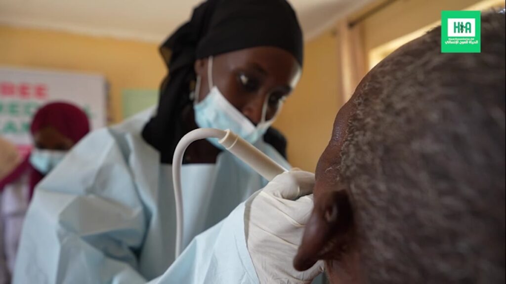 A nurse examining a patient at the free medical camp in Kenya
